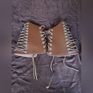 Brown leather arm cuffs
